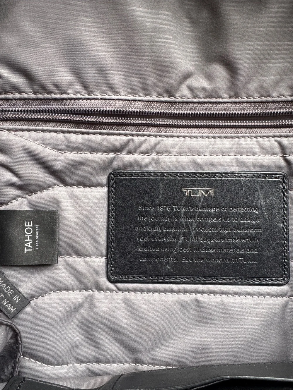 Tumi Black Leather and Brown Leaf-Print Backpack USED